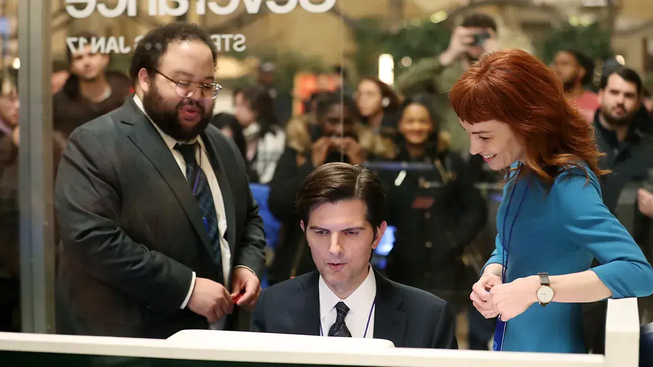 a photo of (from left to right) zach cherry, adam scott, and britt lower in grand central station at the severance pop-up